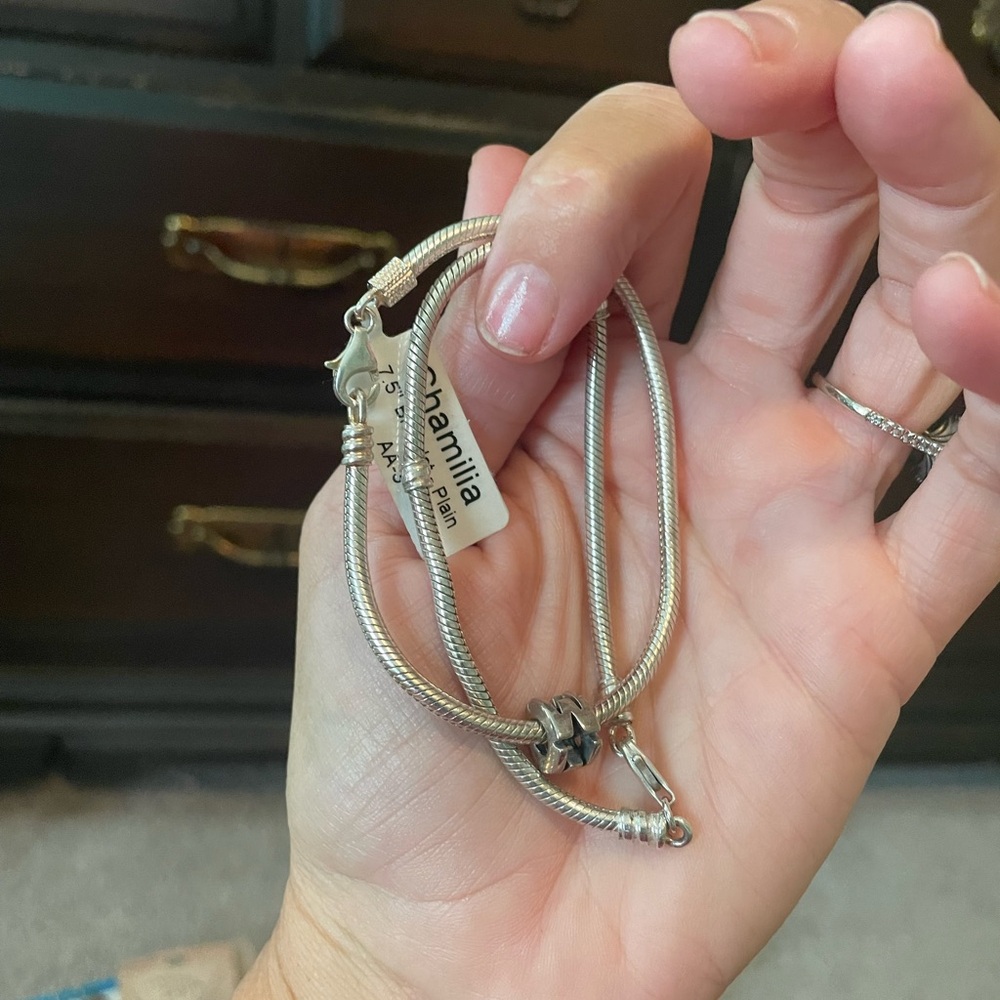 Two chamilla bracelets.  One still has tag.